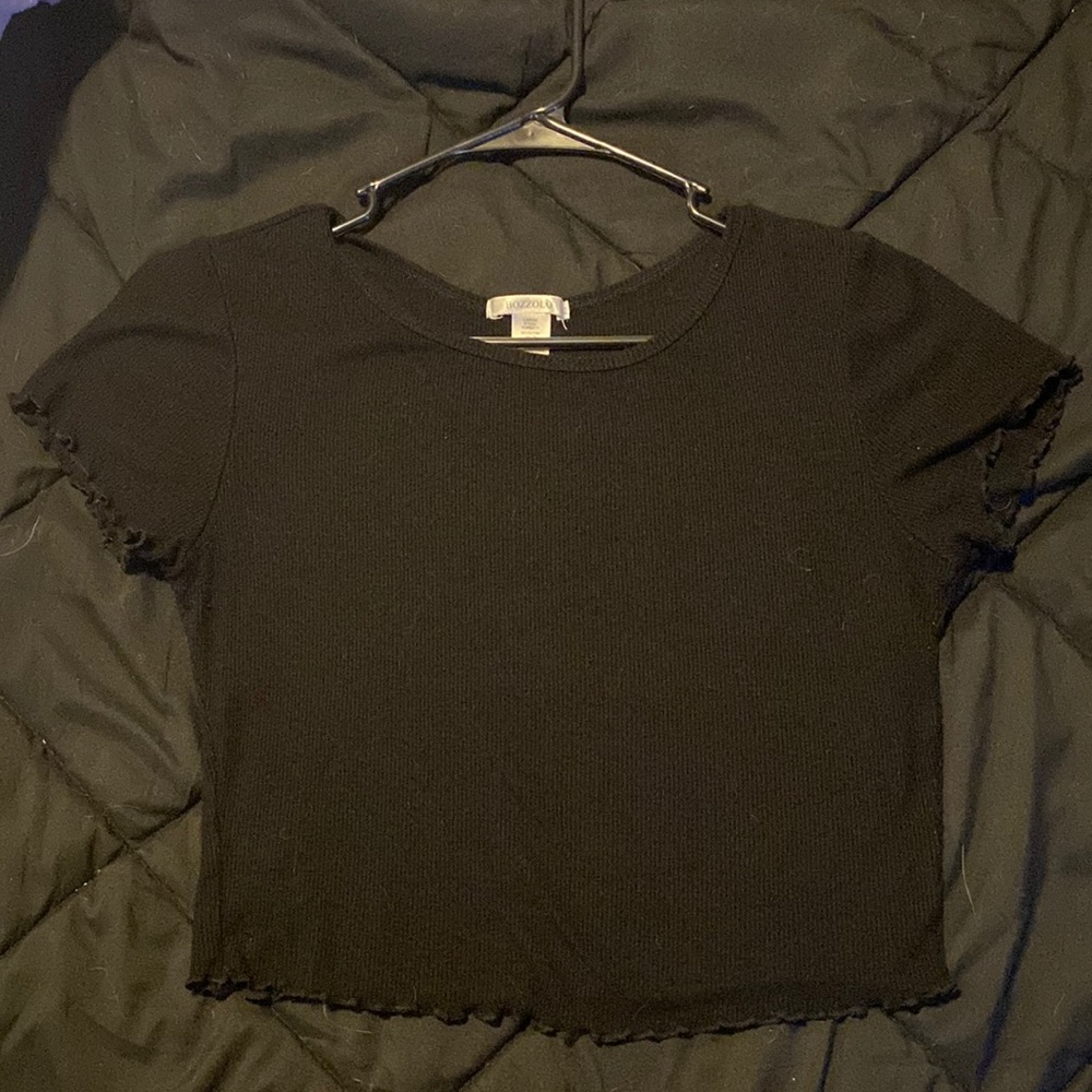 This is a crop top. Color is black. The size is a large.